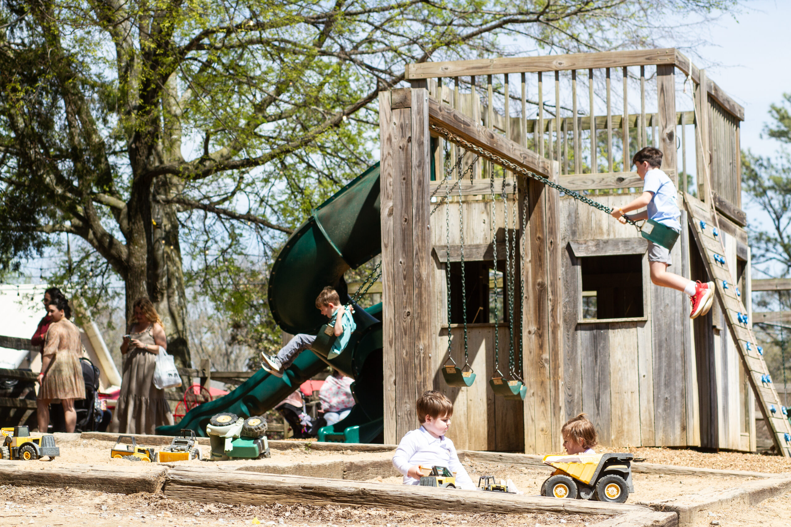 Enjoying giant slides and play areas