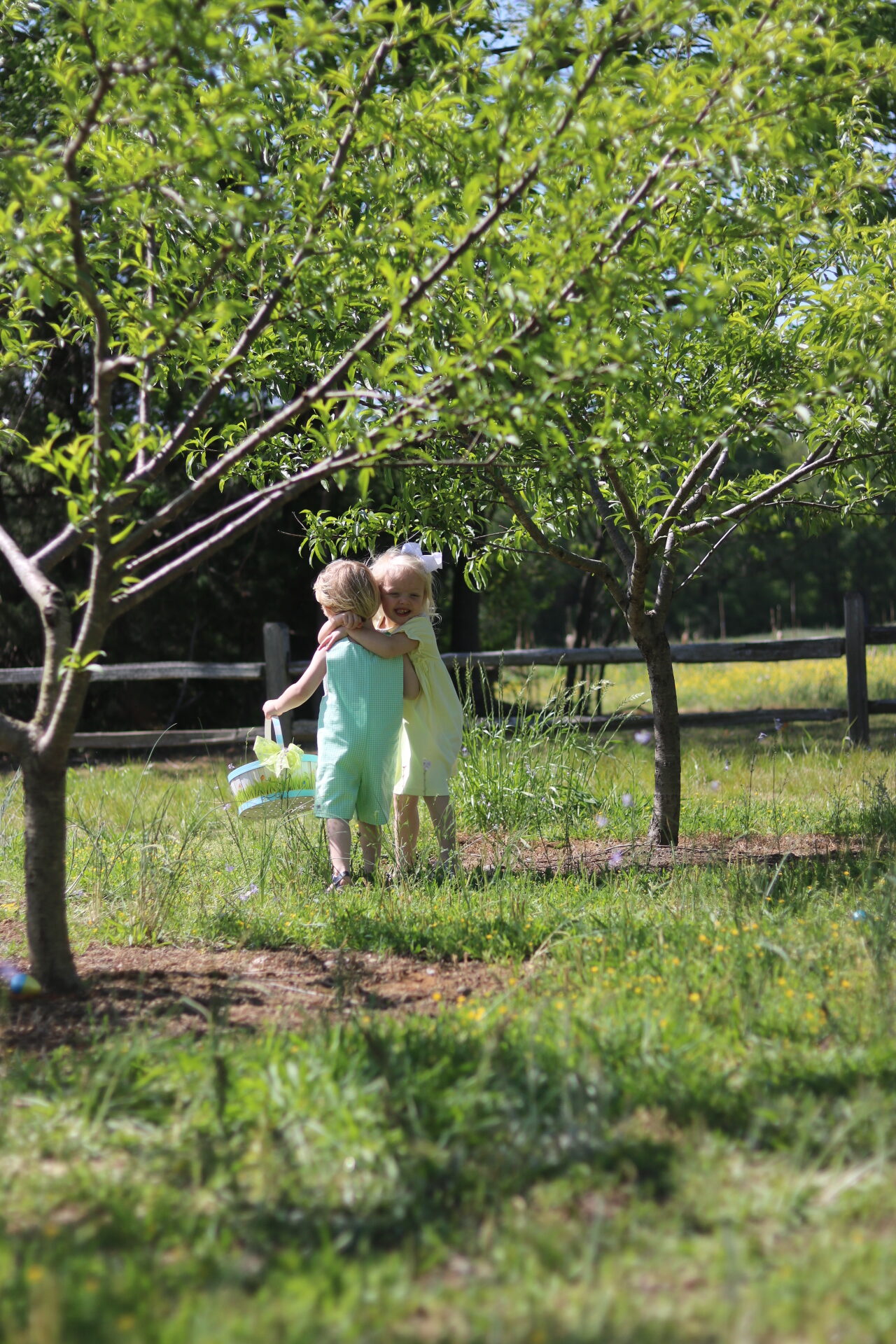 Group of kids hunting Easter eggs on the farm