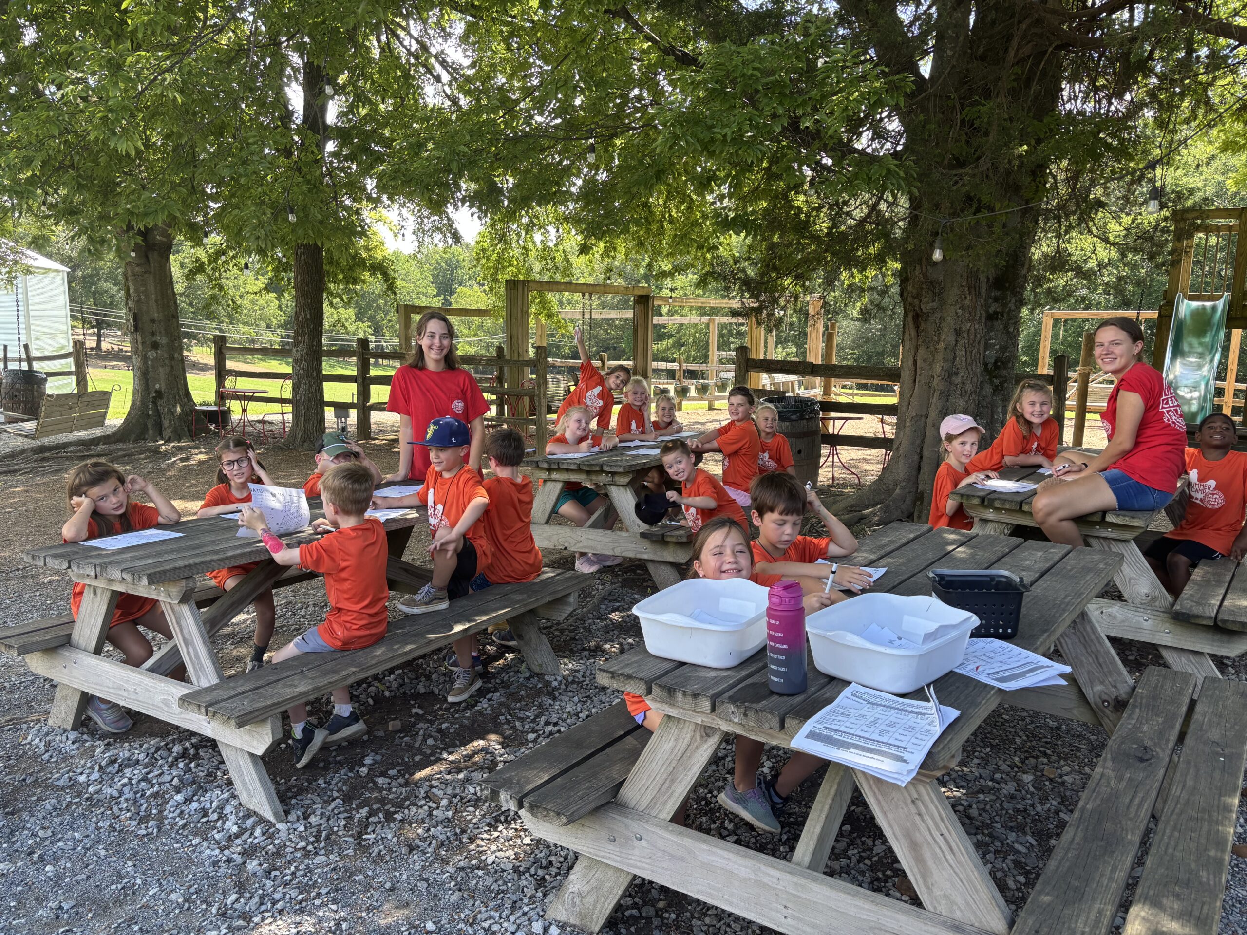 Kids learning gardening and planting at summer camp